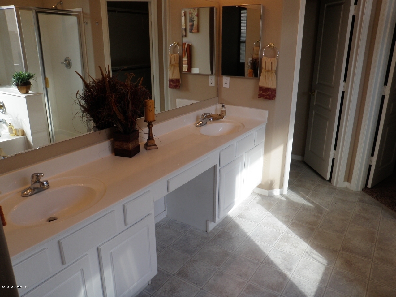 3672 South Martingale Road Gilbert, AZ 85297 - Photo 23 of 45 a bathroom with a double vanity sink and a mirror