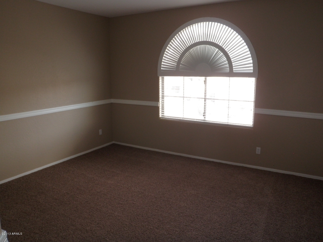 3672 South Martingale Road Gilbert, AZ 85297 - Photo 30 of 45 an empty room with a window