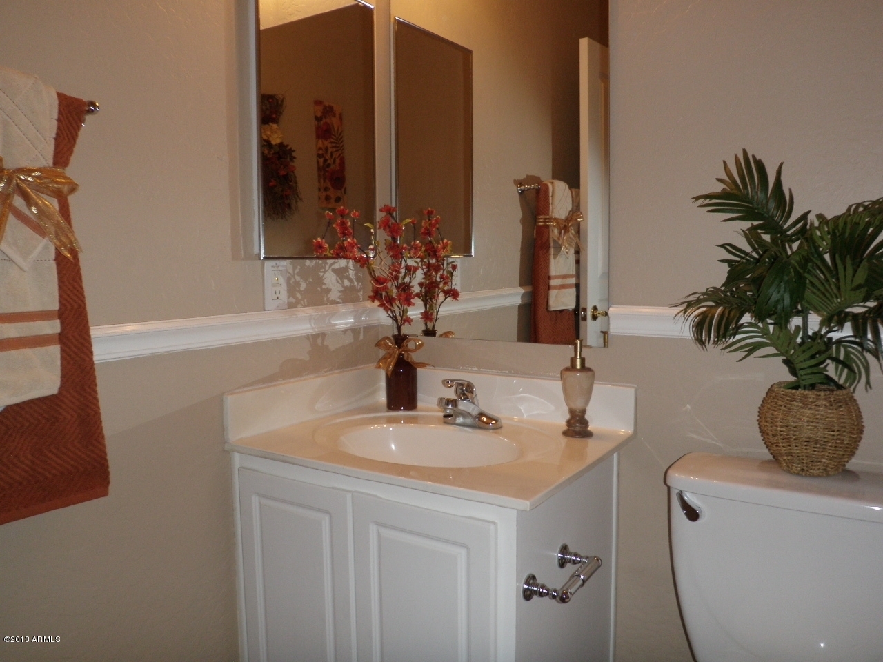 3672 South Martingale Road Gilbert, AZ 85297 - Photo 34 of 45 a bathroom with a sink a vanity and a mirror