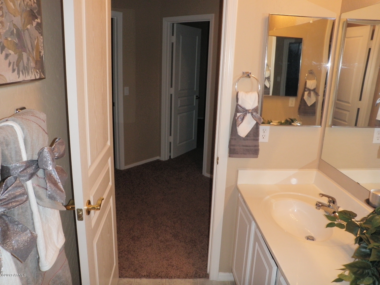 3672 South Martingale Road Gilbert, AZ 85297 - Photo 35 of 45 a bathroom with a sink and a mirror