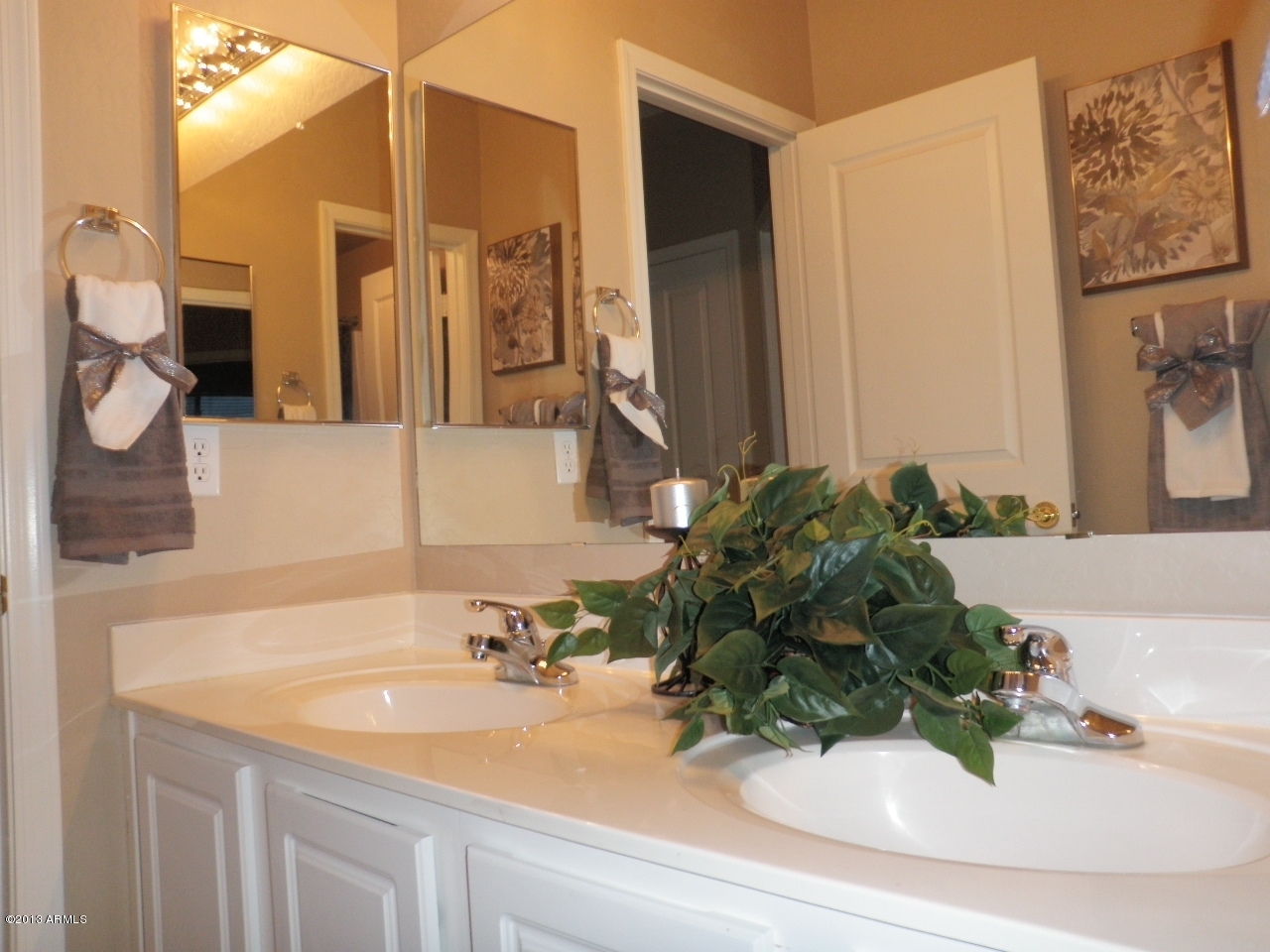 3672 South Martingale Road Gilbert, AZ 85297 - Photo 36 of 45 a bathroom with a sink and a mirror