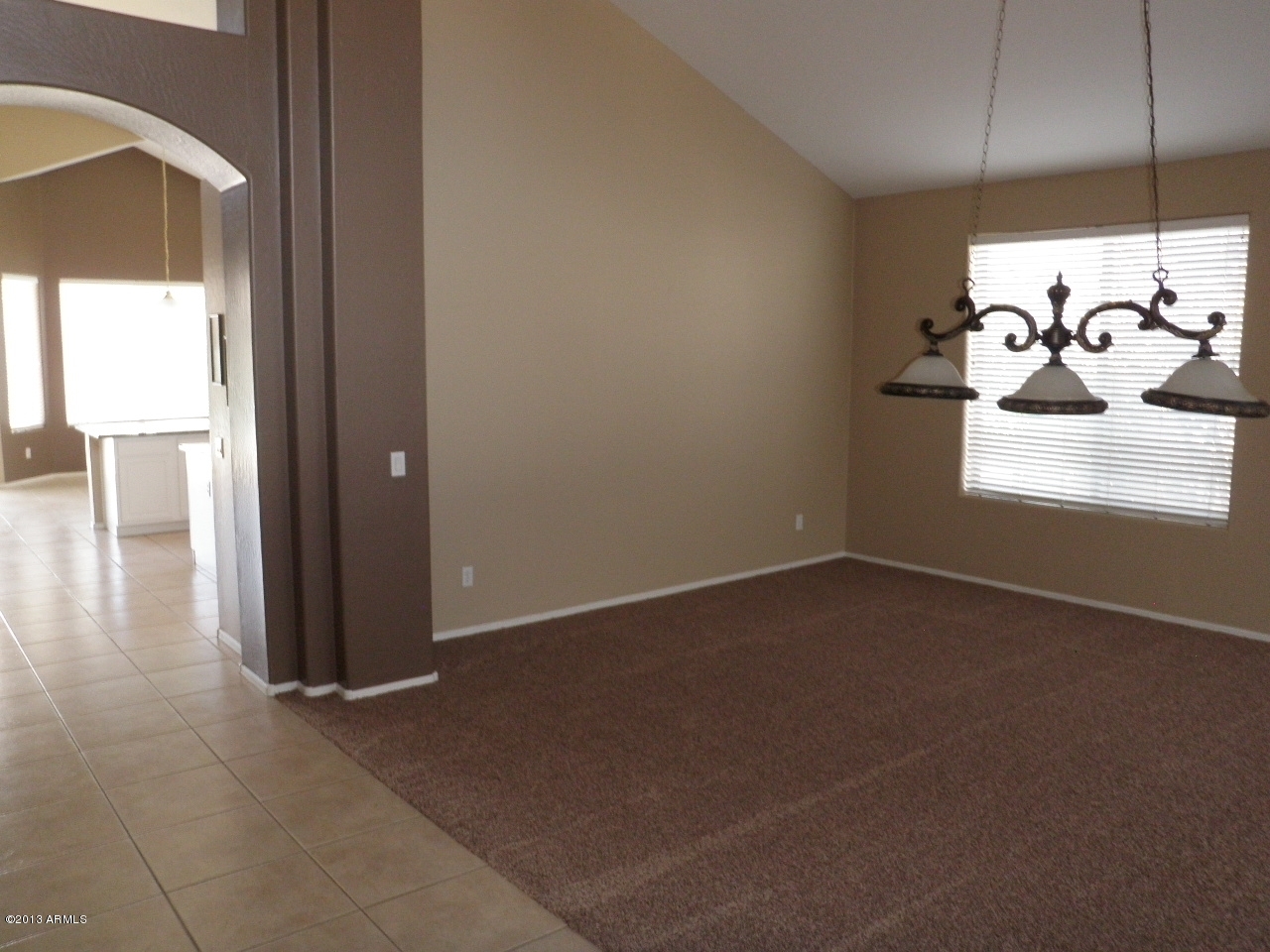 3672 South Martingale Road Gilbert, AZ 85297 - Photo 5 of 45 an empty room with wooden floor and windows