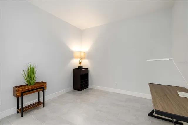 a room with furniture and a potted plant