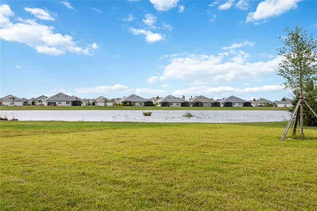 an aerial view of a house with a swimming pool
