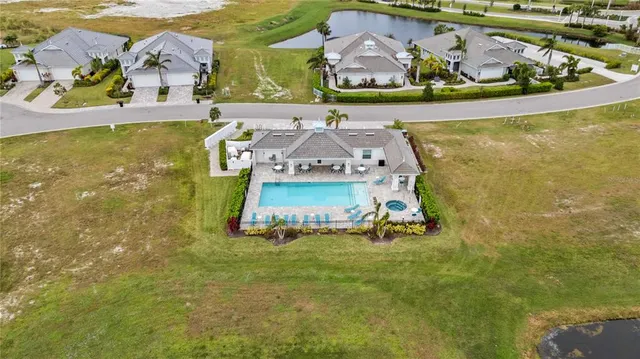 aerial view of a house with a yard