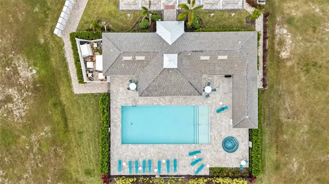 a view of an swimming pool with seating area