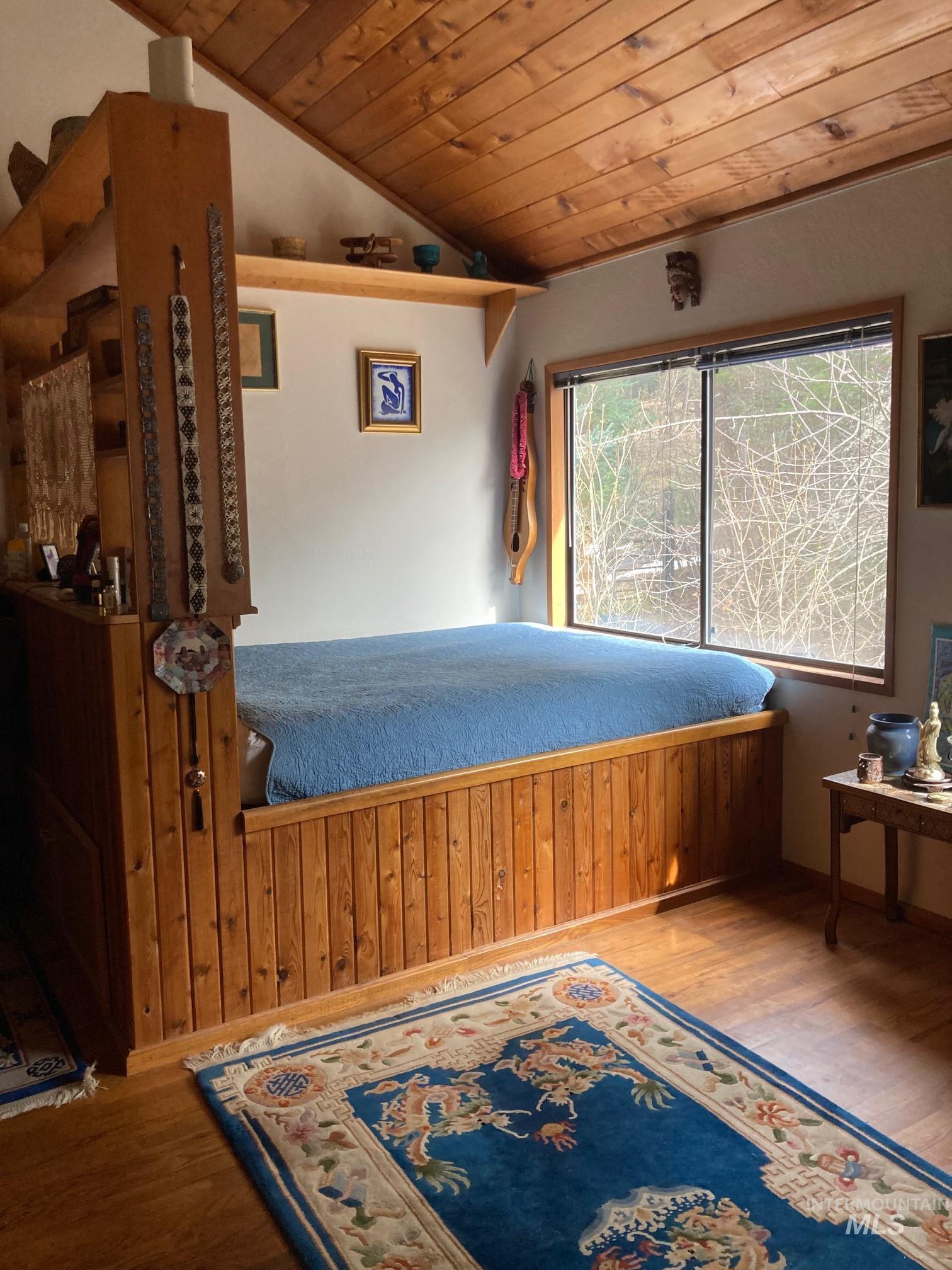 266 Falcon Ridge Road Kooskia, ID 83539 - Photo 12 of 50 Room featuring a built-in platform bed with natural wood paneling