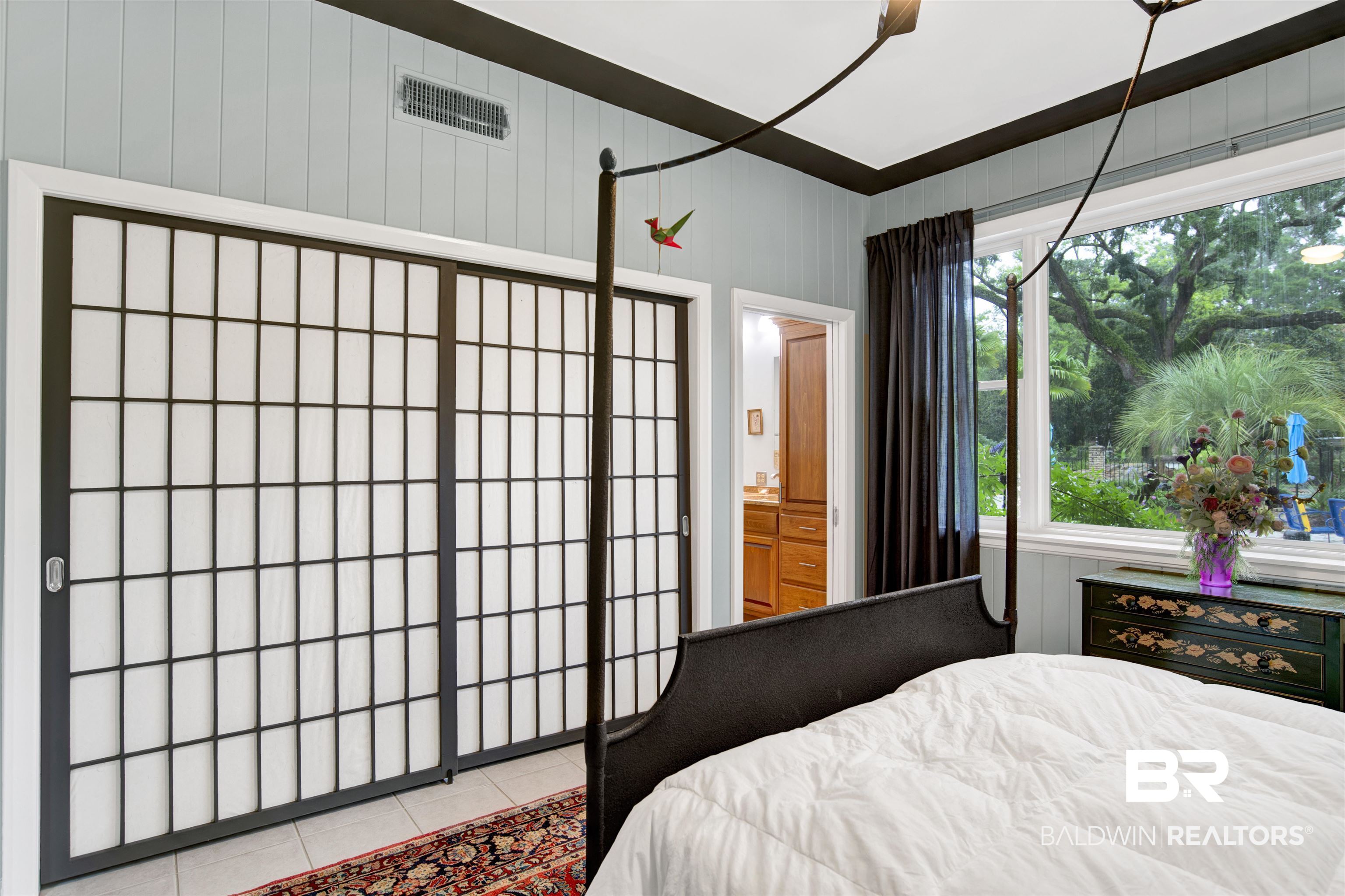 809 Bernard Circle Mobile, AL 36693 - Photo 21 of 75 Window with outdoor scenery, sliding closet doors, ceiling with crown molding, and tiled flooring