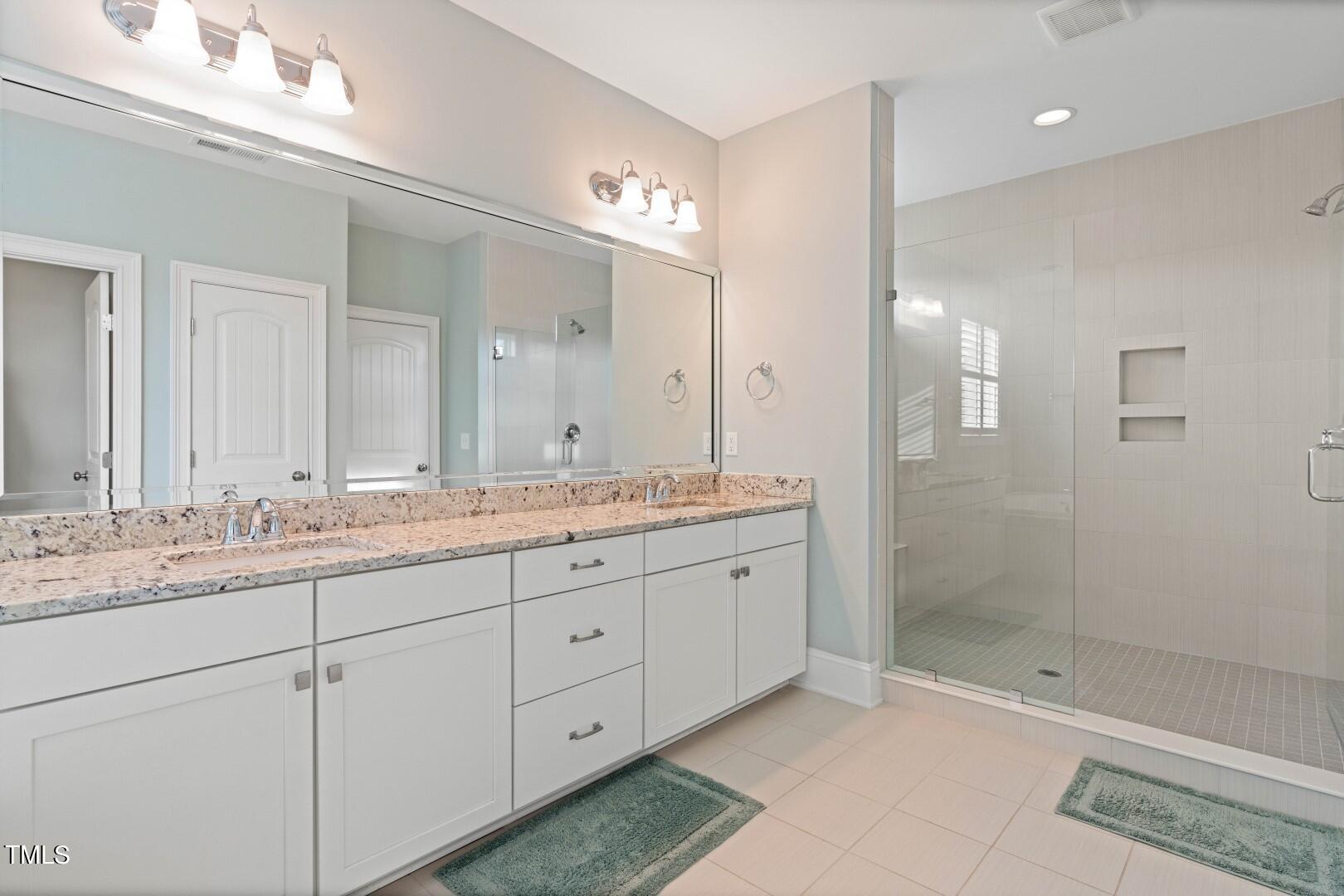 3009 Adonis Circle Raleigh, NC 27612 - Photo 41 of 49 a bathroom with a granite countertop sink mirror and double