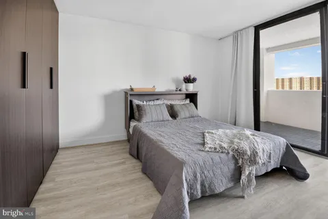 a bedroom with a bed and window