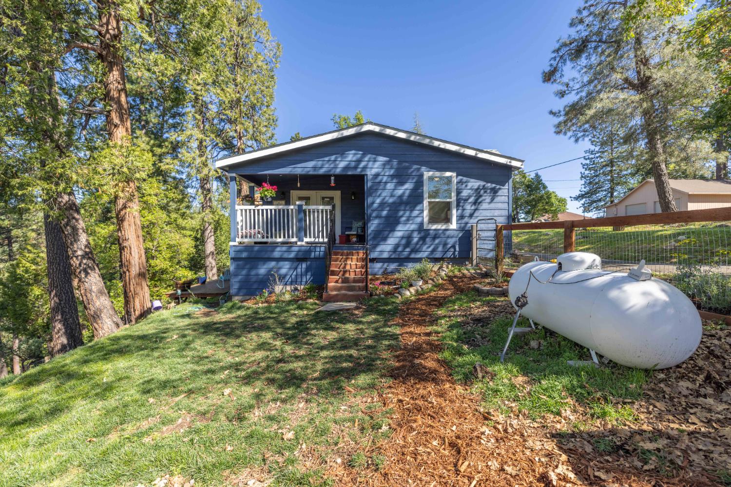 5015 Shooting Star Road Pollock Pines, CA 95726 - Photo 27 of 44 a view of a house with a yard