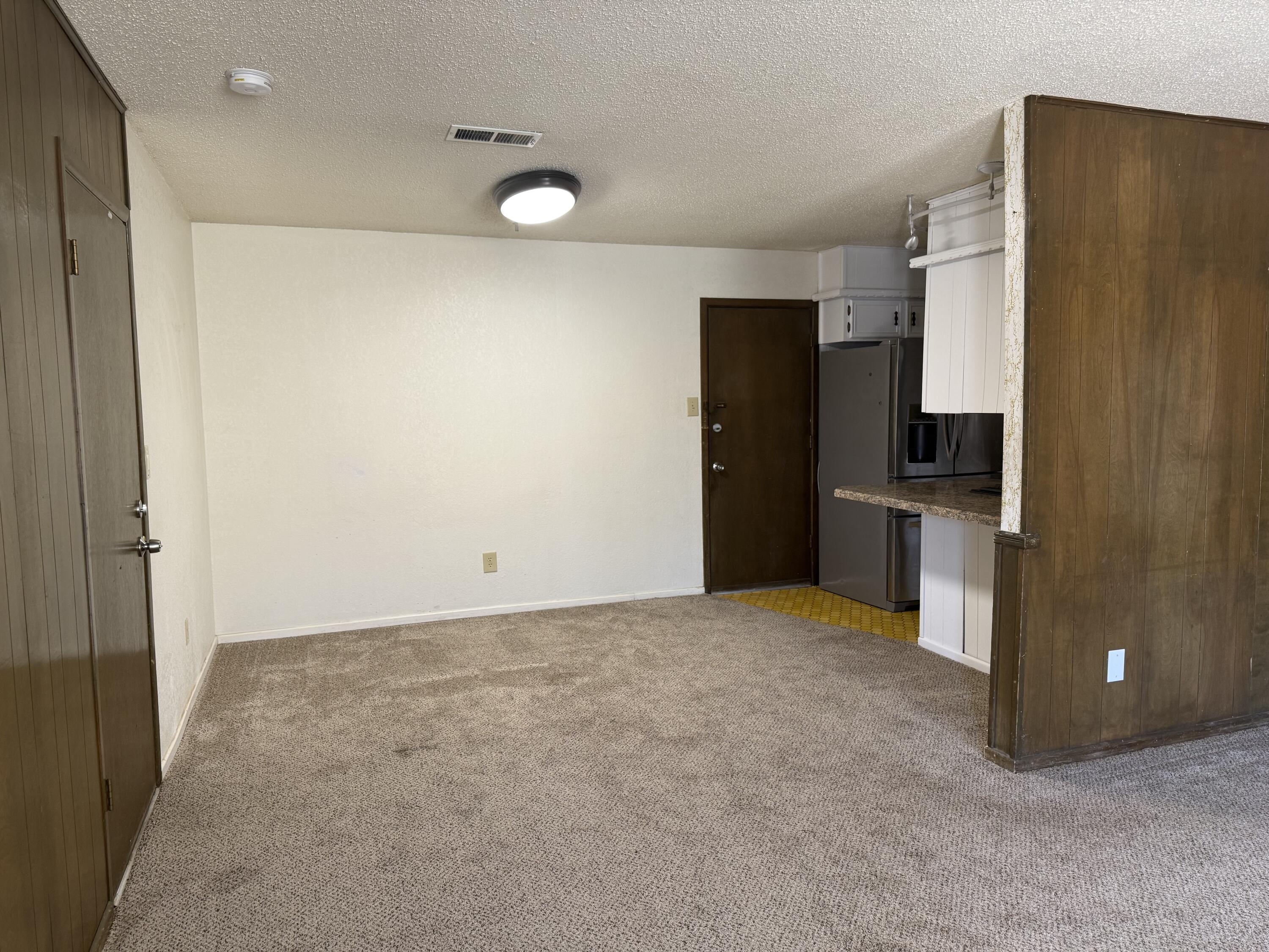 4425 75th Drive, Unit B Lubbock, TX 79424 - Photo 4 of 10 a view of an empty room