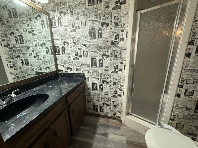 view of a bathroom with toilet sink and shower