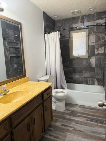 a bathroom with a bathtub and a toilet