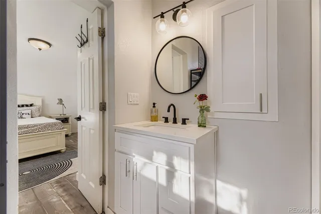a bathroom with a sink and a mirror