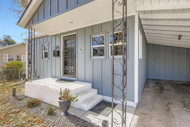 a outdoor space with balcony a sink and glass door