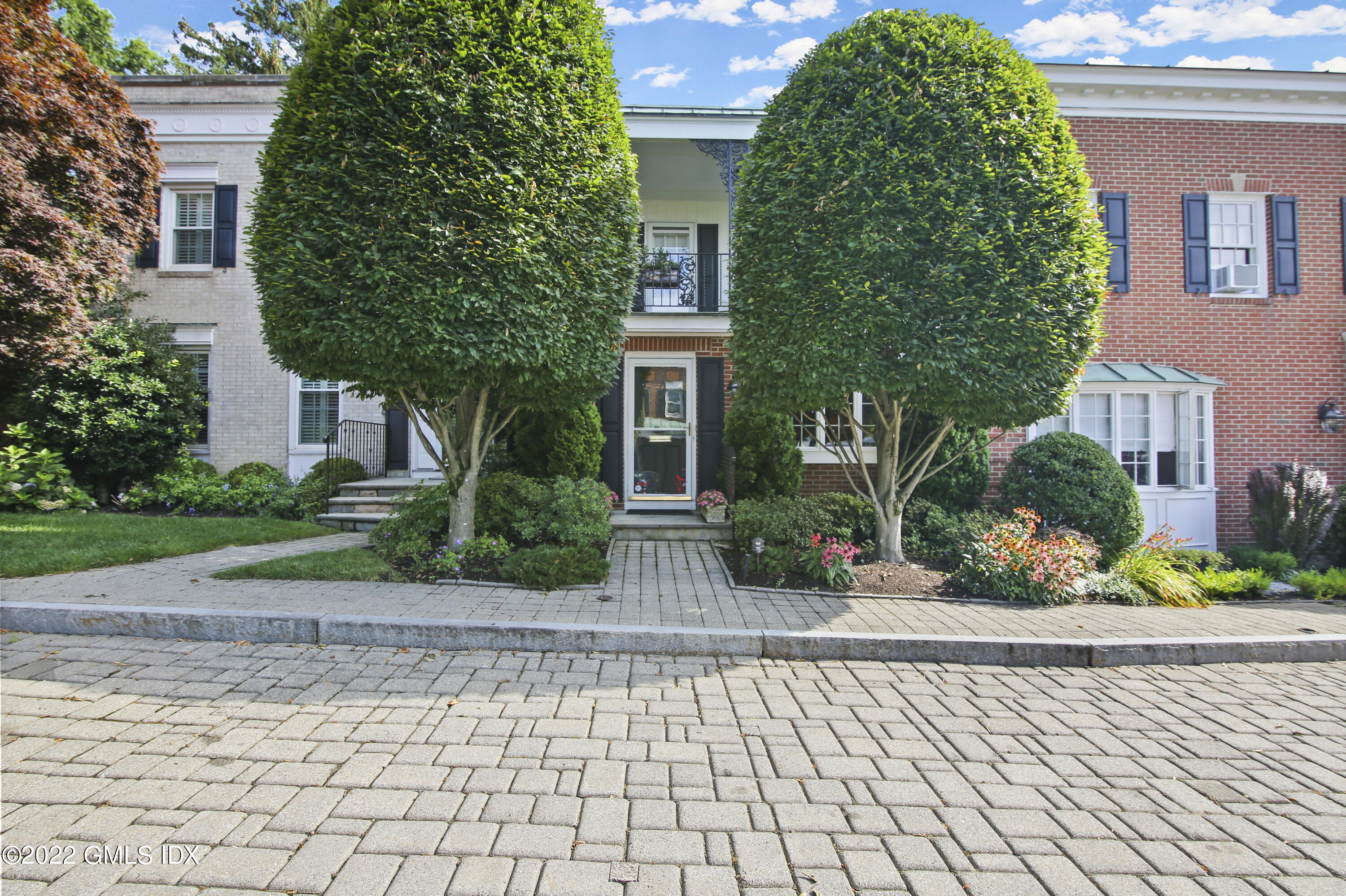 a view of a house with a garden