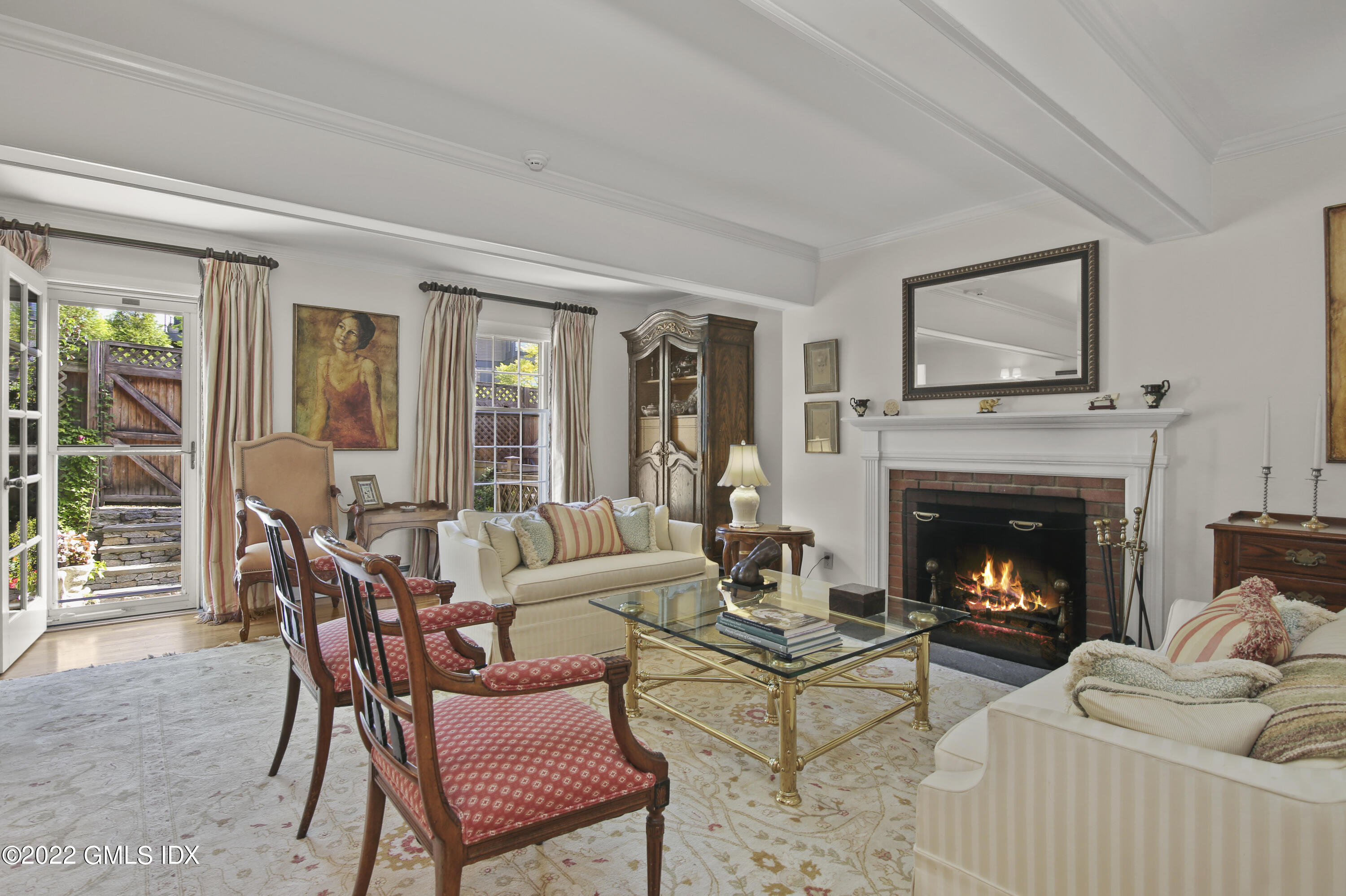 155 Field Point Road, Unit 2N Greenwich, CT 06830 - Photo 6 of 19 a living room with furniture and a fireplace