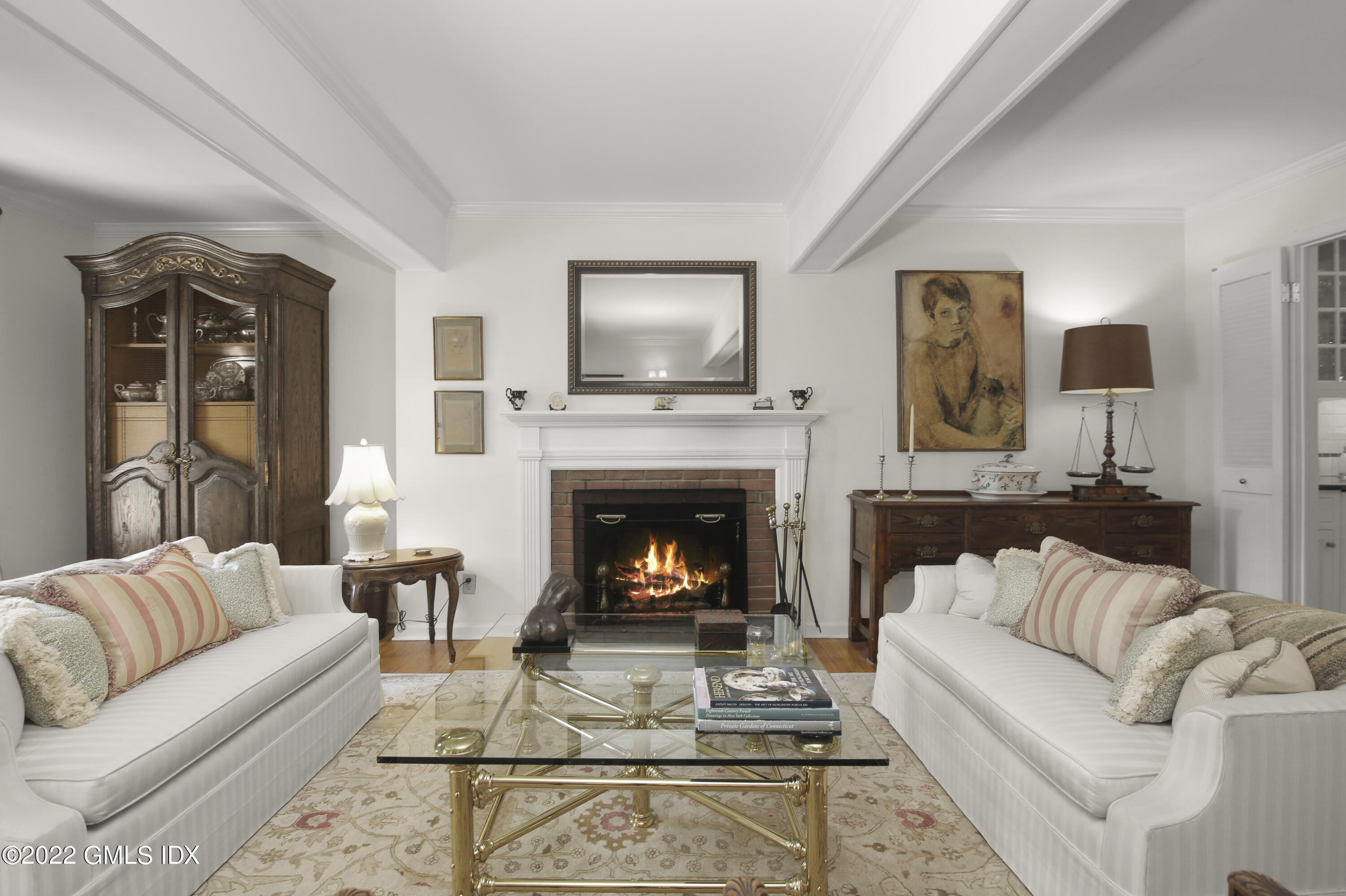 155 Field Point Road, Unit 2N Greenwich, CT 06830 - Photo 7 of 19 a living room with furniture and a fireplace
