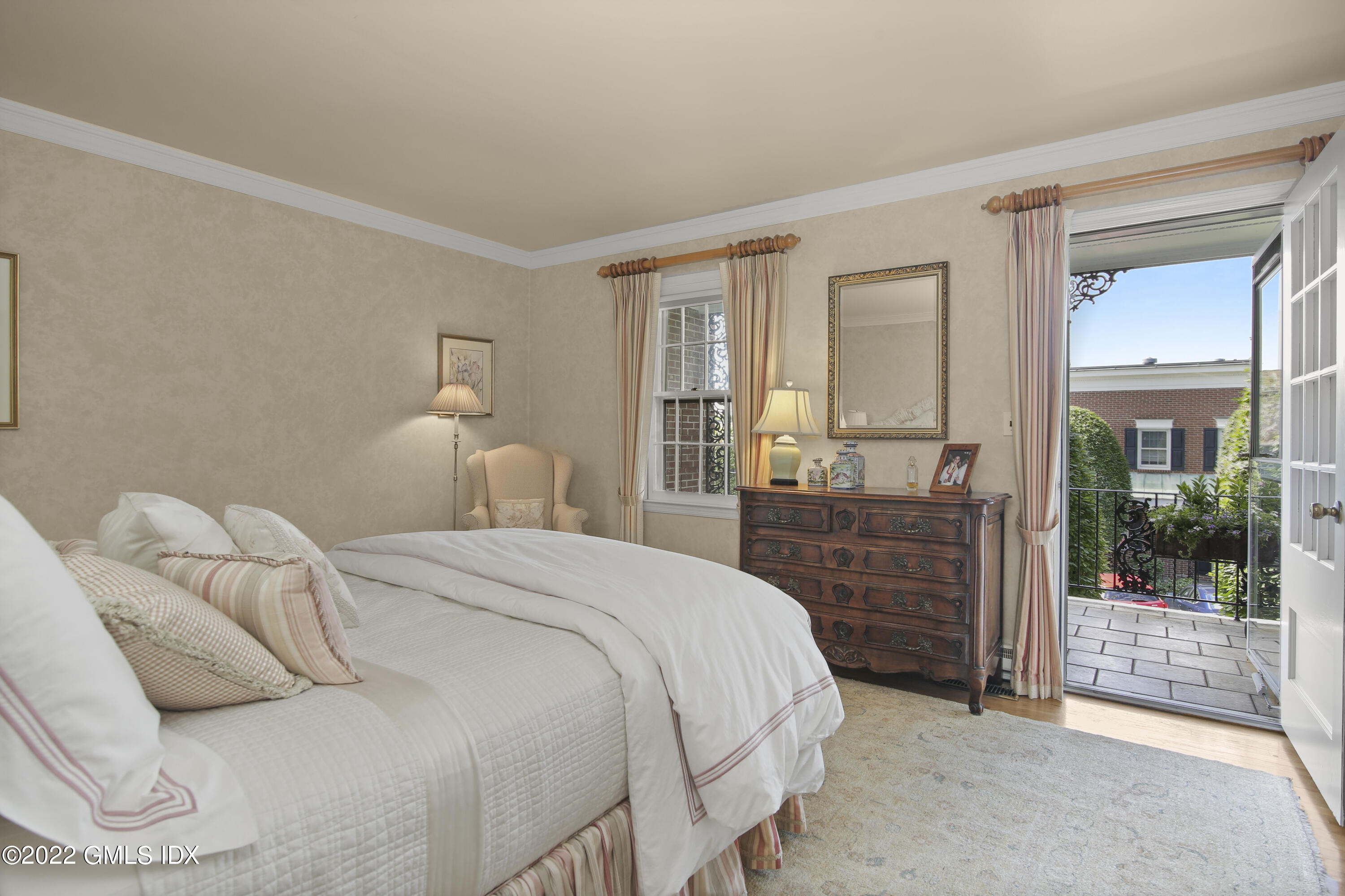 155 Field Point Road, Unit 2N Greenwich, CT 06830 - Photo 8 of 19 a bedroom with a bed and wooden floor