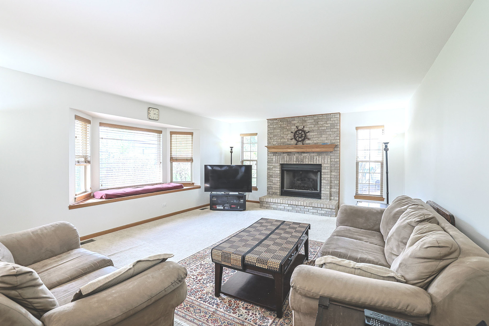 3080 Wagner Road Aurora, IL 60502 - Photo 11 of 31 a living room with furniture or couch and a fireplace