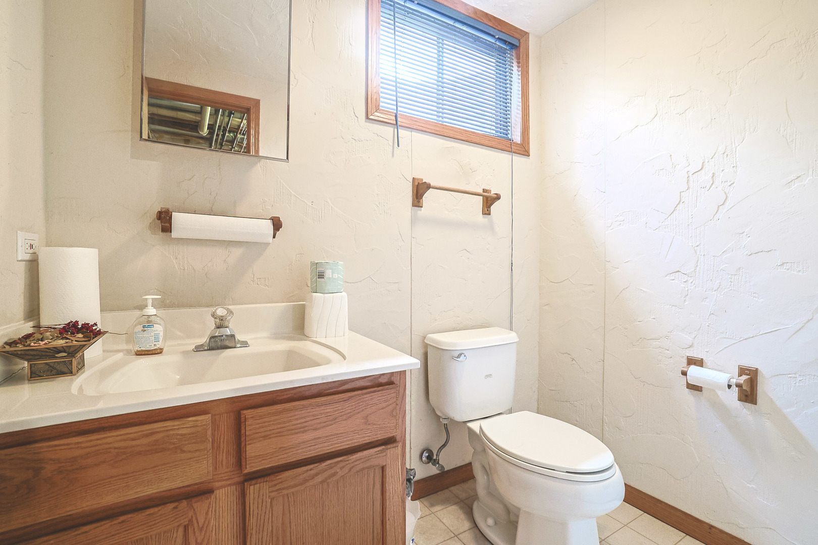 3080 Wagner Road Aurora, IL 60502 - Photo 13 of 31 a bathroom with a sink mirror vanity and toilet