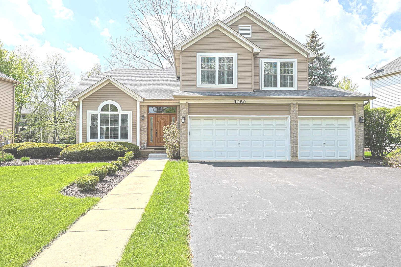 3080 Wagner Road Aurora, IL 60502 - Photo 2 of 31 a front view of a house with a yard and garage