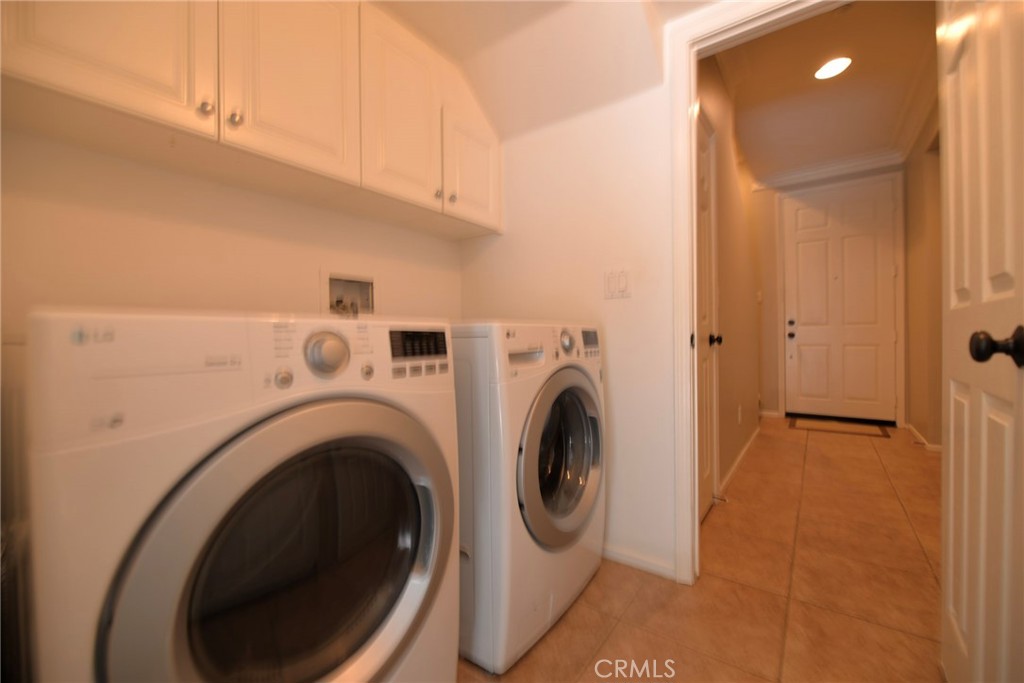 24 Paseo Rosa San Clemente, CA 92673 - Photo 27 of 35 a view of a hallway with washer and dryer