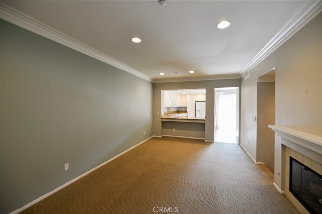 24 Paseo Rosa San Clemente, CA 92673 - Photo 9 of 35 a view of an empty room with a fireplace and a window