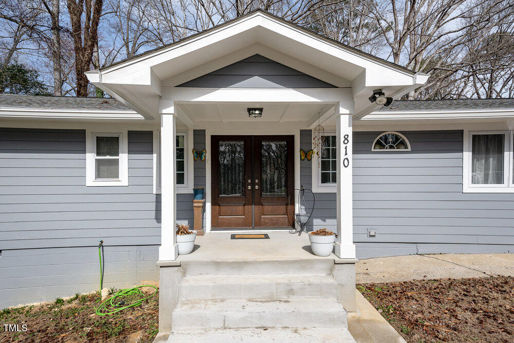 810 Grovemont Road Raleigh, NC 27603 - Photo 3 of 23 a front view of a house with garden