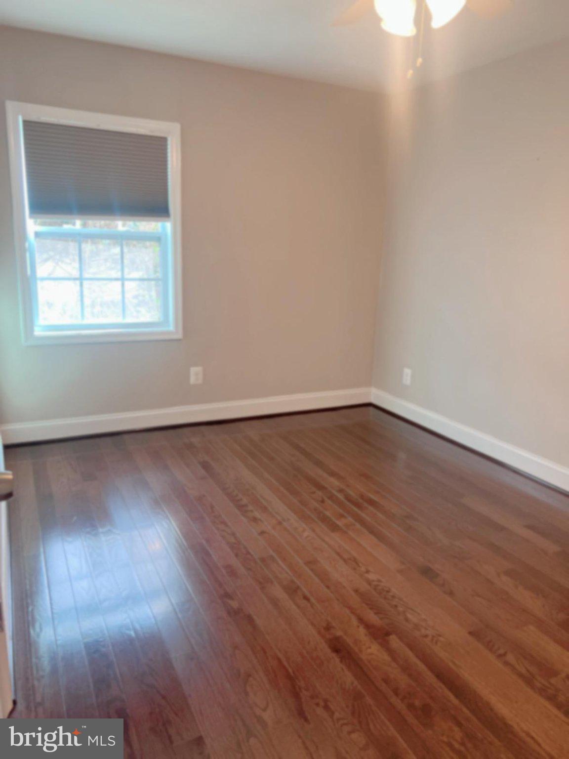 2006 Griffith Road Falls Church, VA 22043 - Photo 10 of 17 an empty room with wooden floor and windows