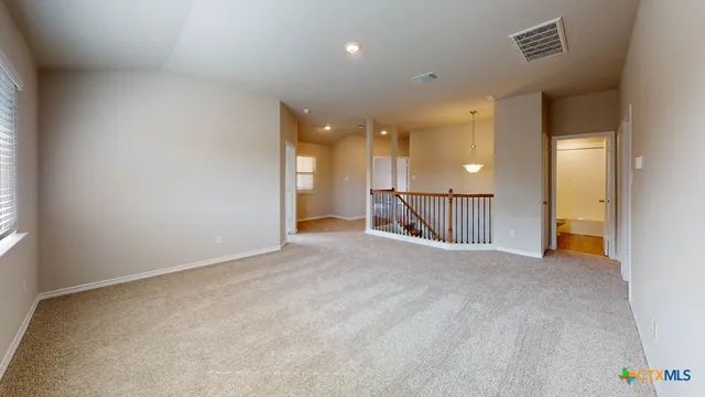 a view of a livingroom with a staircase