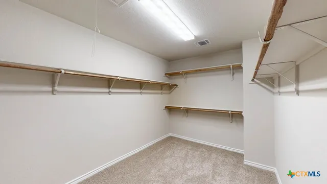 a view of a room with racks on the wall