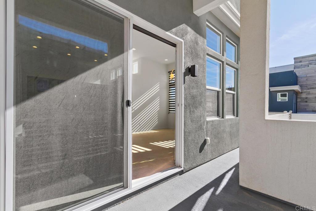 2012 Foxtrot Loop, Unit 3 Chula Vista, CA 91915 - Photo 14 of 34 a bathroom with a glass shower door and mirror