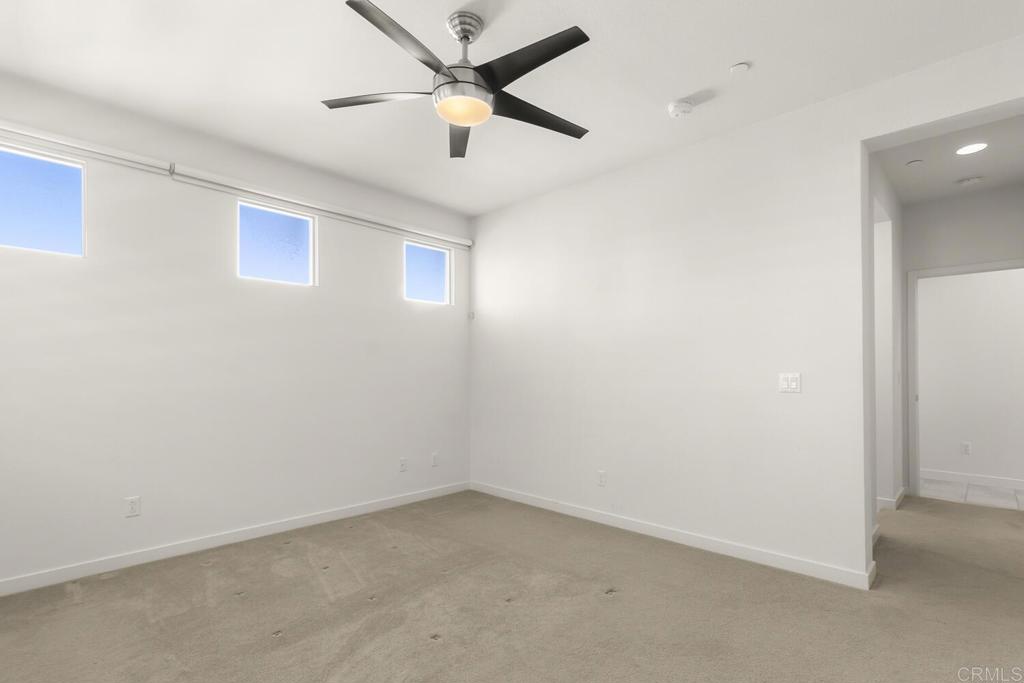 2012 Foxtrot Loop, Unit 3 Chula Vista, CA 91915 - Photo 16 of 34 an empty room with a window and a fan