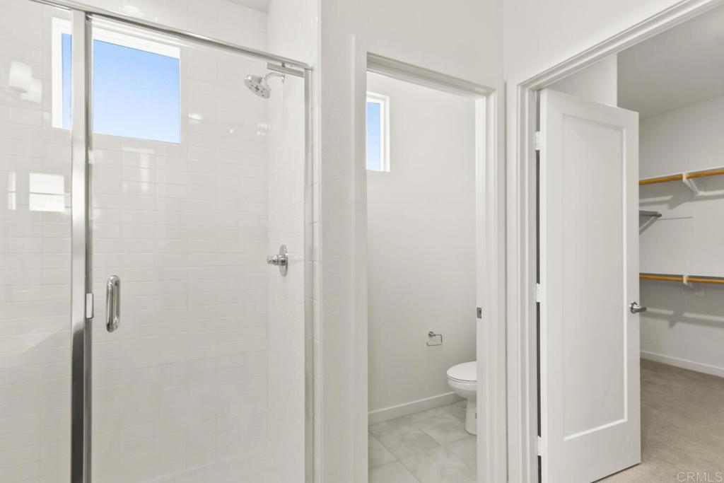 2012 Foxtrot Loop, Unit 3 Chula Vista, CA 91915 - Photo 19 of 34 a bathroom that has a glass shower door