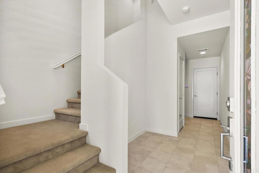 2012 Foxtrot Loop, Unit 3 Chula Vista, CA 91915 - Photo 3 of 34 a view of entryway and hall with a toilet