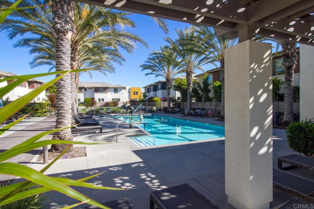 2012 Foxtrot Loop, Unit 3 Chula Vista, CA 91915 - Photo 34 of 34 a view of a patio with table and chairs potted plants and large tree