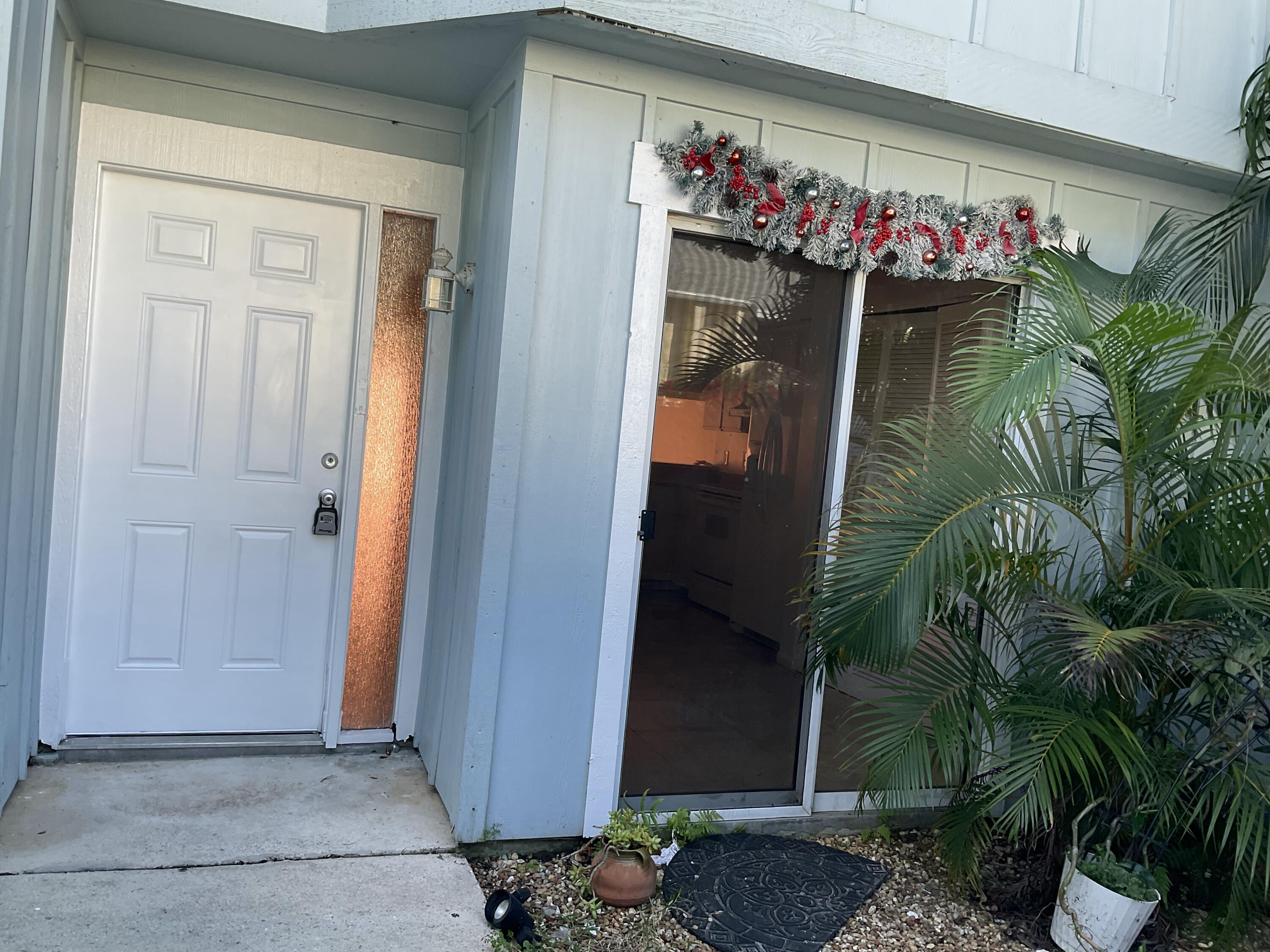 6262 Riverwalk Lane, Unit 3 Jupiter, FL 33458 - Photo 18 of 28 a front view of a house