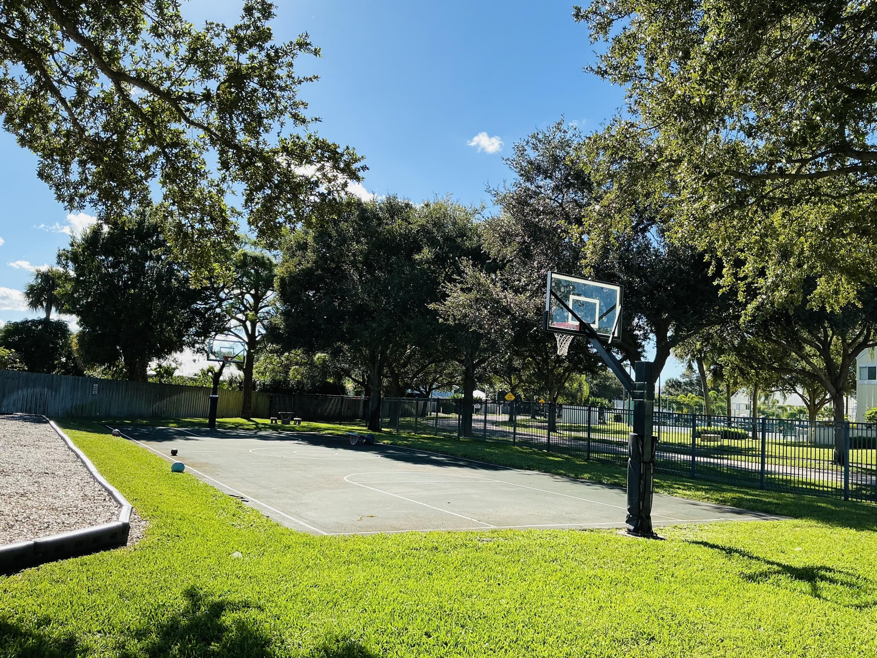 6262 Riverwalk Lane, Unit 3 Jupiter, FL 33458 - Photo 20 of 28 a view of a park with large trees