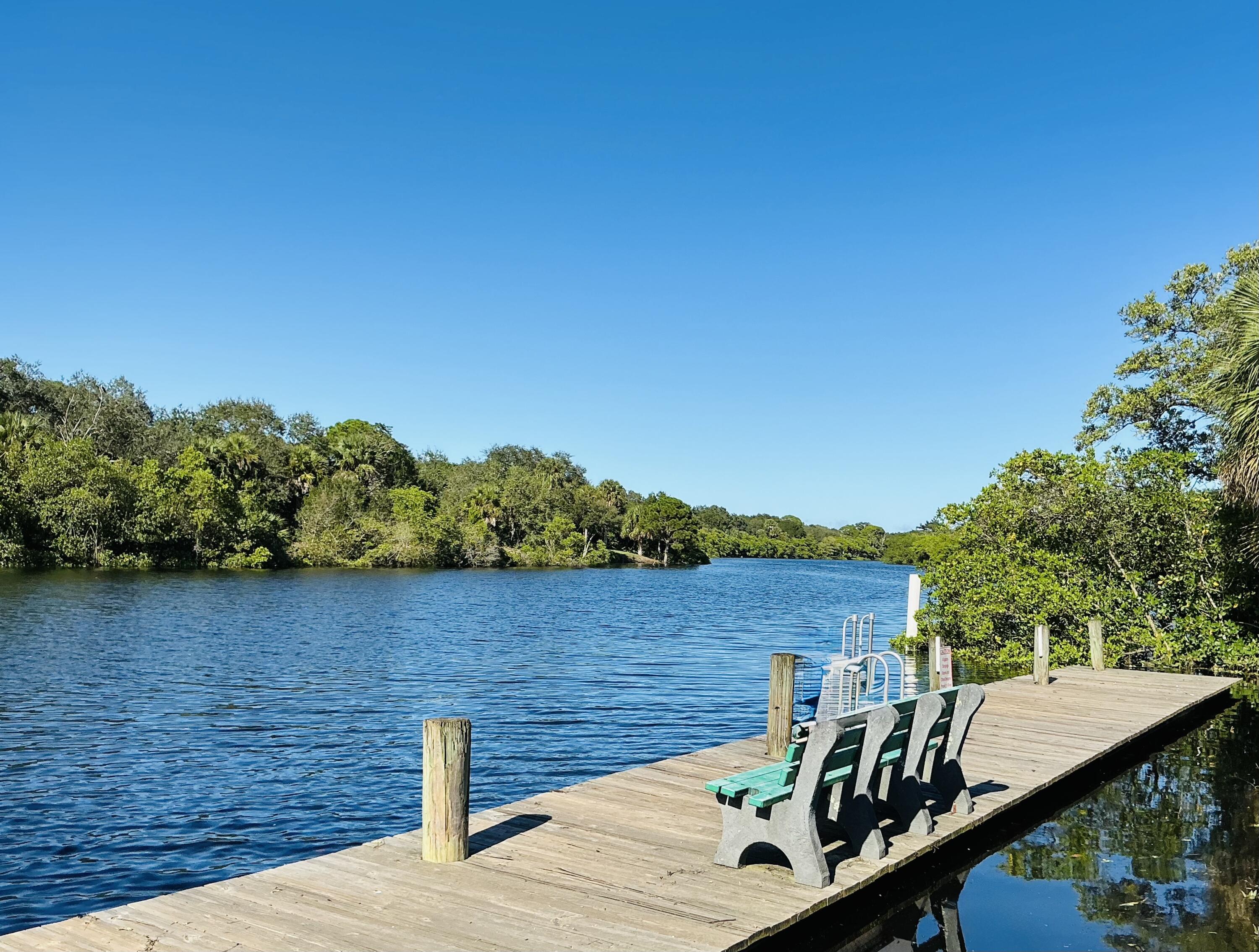 6262 Riverwalk Lane, Unit 3 Jupiter, FL 33458 - Photo 23 of 28 a view of a lake with a mountain view