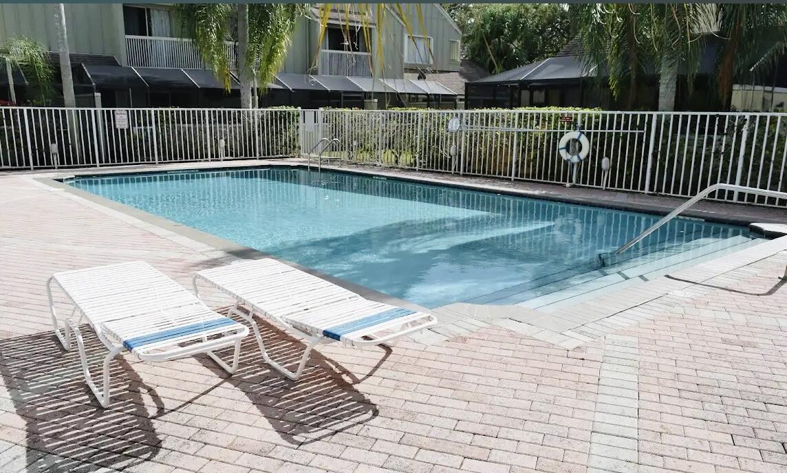 6262 Riverwalk Lane, Unit 3 Jupiter, FL 33458 - Photo 25 of 28 a view of a terrace with a lake view