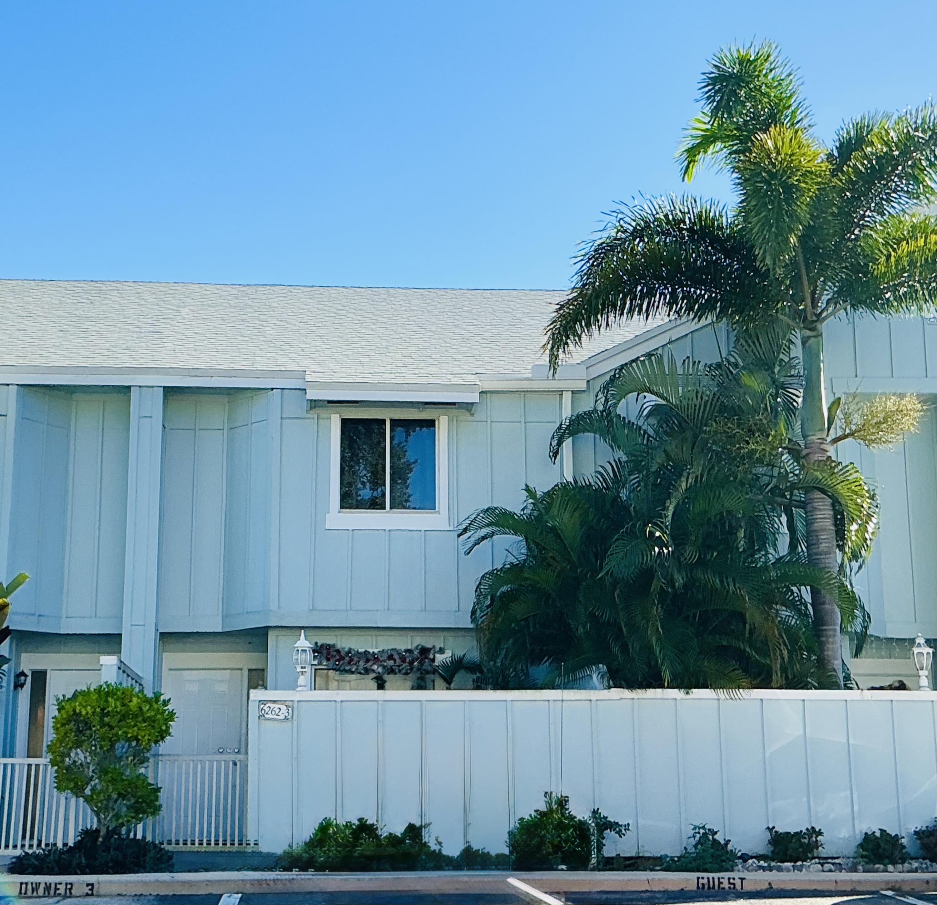 6262 Riverwalk Lane, Unit 3 Jupiter, FL 33458 - Photo 28 of 28 a front view of a house with a yard
