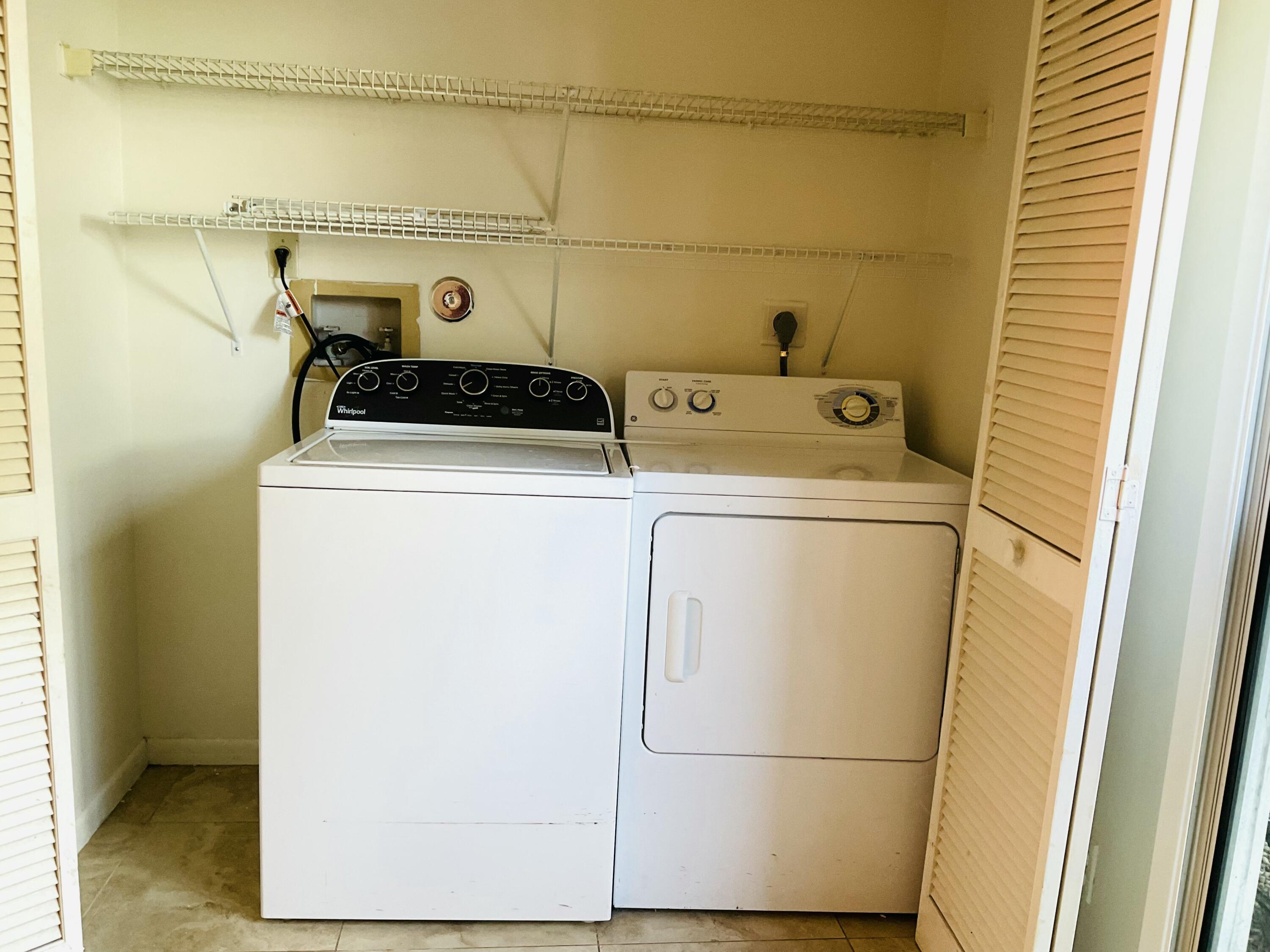 6262 Riverwalk Lane, Unit 3 Jupiter, FL 33458 - Photo 5 of 28 a utility room with dryer and washer