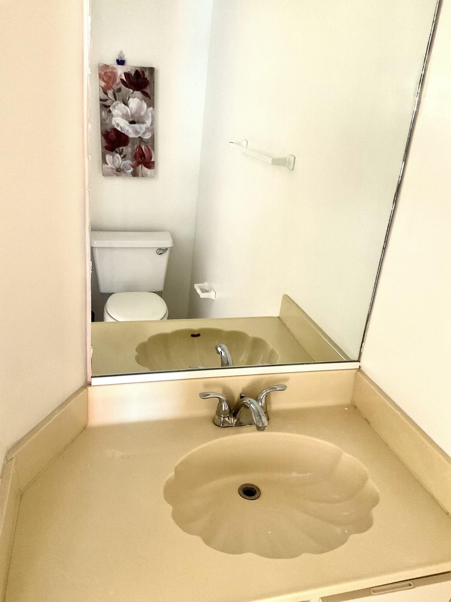 6262 Riverwalk Lane, Unit 3 Jupiter, FL 33458 - Photo 10 of 28 a bathroom with a sink and toilet