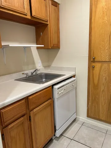 a kitchen with a sink and cabinets