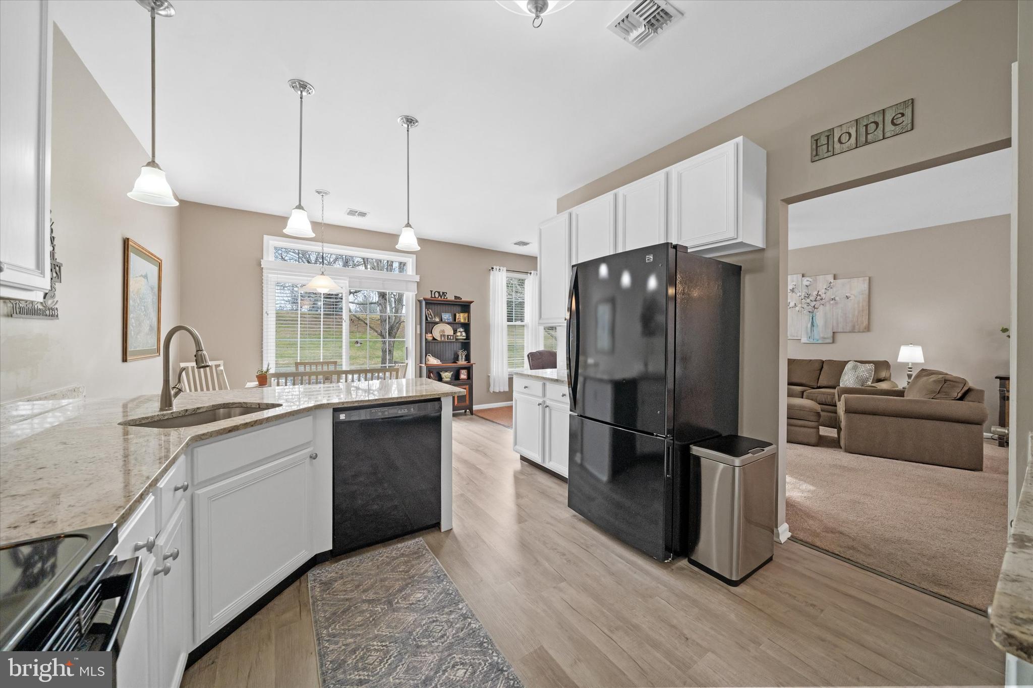 20 Hunters Way Glen Mills, PA 19342 - Photo 11 of 36 a kitchen with granite countertop a refrigerator and a sink