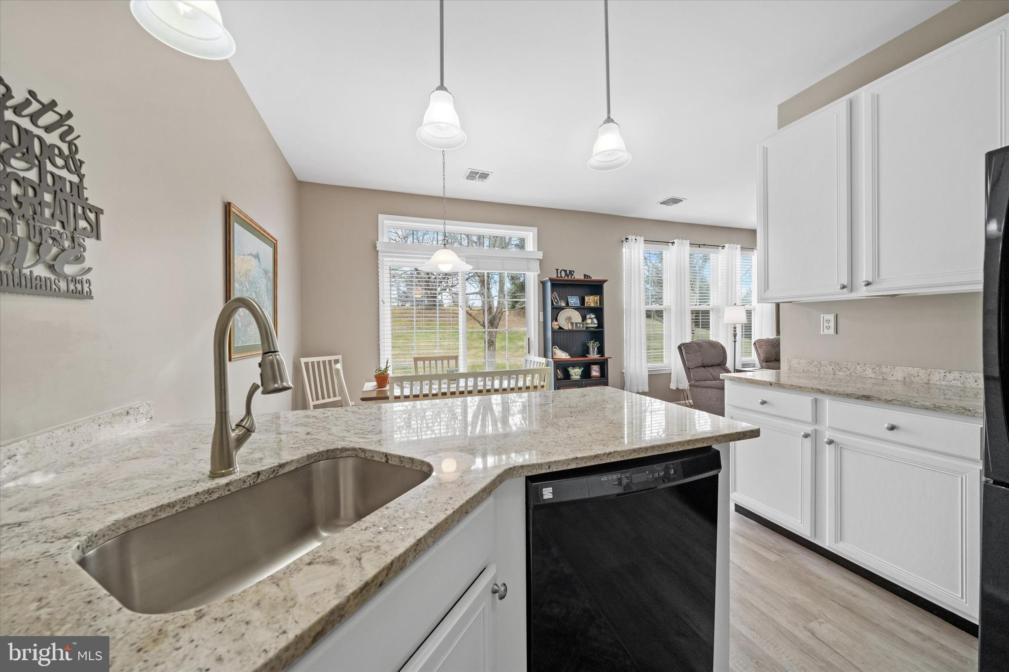 20 Hunters Way Glen Mills, PA 19342 - Photo 14 of 36 a kitchen with granite countertop a sink a counter top space and cabinets