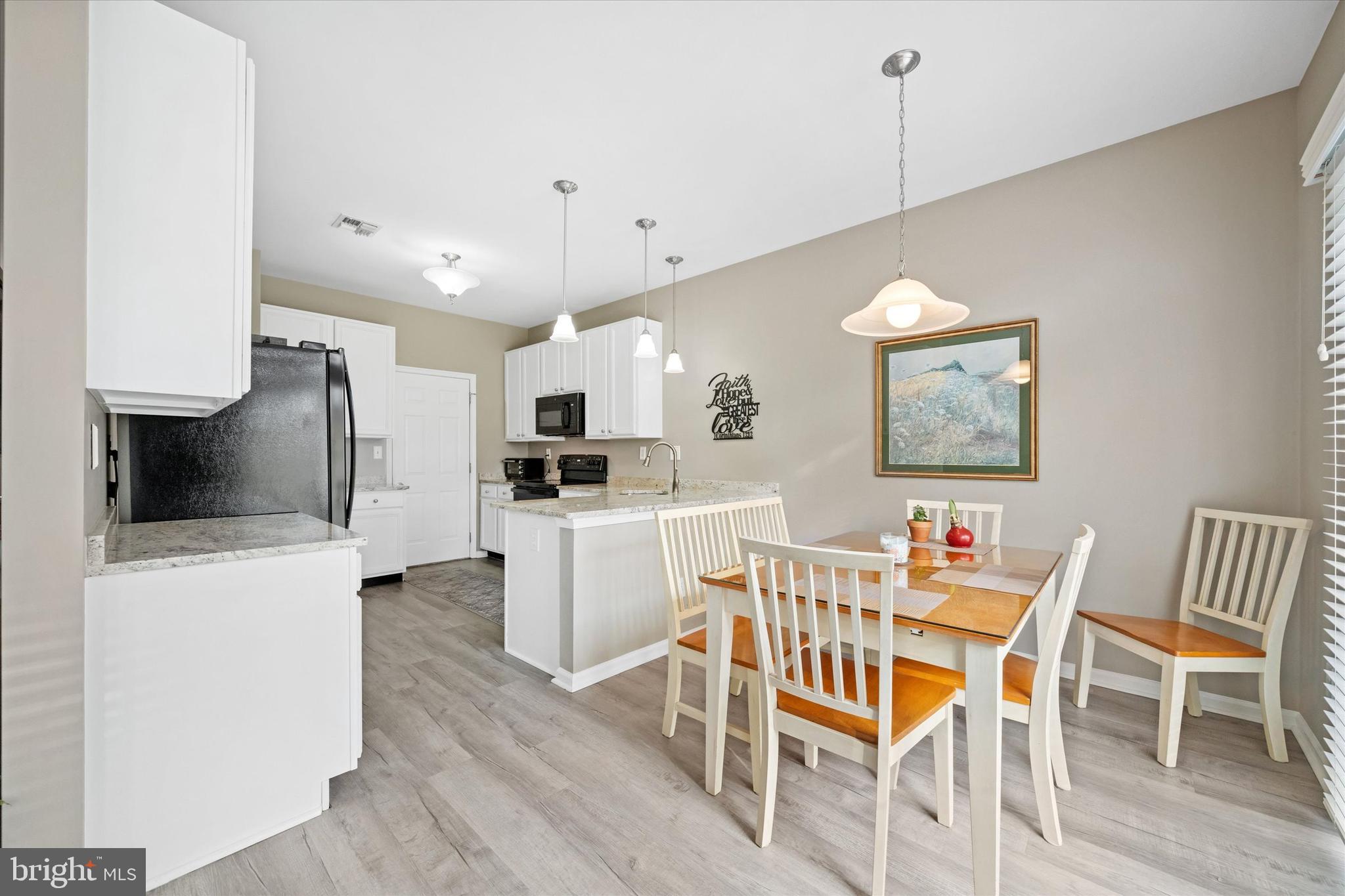20 Hunters Way Glen Mills, PA 19342 - Photo 17 of 36 a view of kitchen with furniture and wooden floor