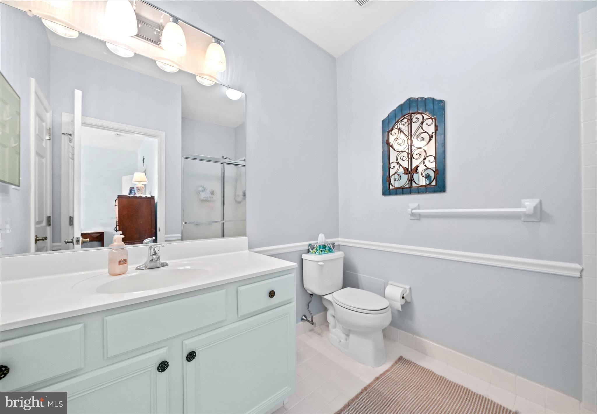 20 Hunters Way Glen Mills, PA 19342 - Photo 23 of 36 a bathroom with a sink a toilet and a mirror